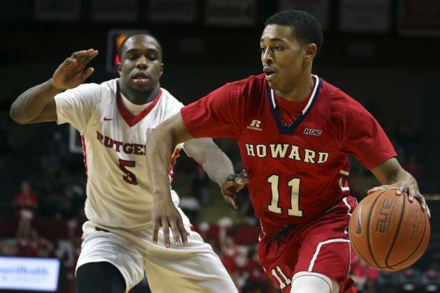 FILE - In this Nov. 15, 2015, file photo, Howard guard James Daniel (11) dribbles the ball past Rutgers guard Mike Williams during the first half of an NCAA college basketball game in Piscataway, N.J. One of the funkier quirks of a season that’s been full of them is that four of the country’s top five scorers entering Friday’s games were 6-foot or shorter. Five-foot-11 Howard guard James Daniel led the way with (28.2 points per game), followed by 5-foot-9 Oakland star Kahlil Felder (25.7), 6-foot Davidson standout Jack Gibbs (24.8) and Stefan Moody, all of 5-foot-10, of Ole Miss (24.3). (AP Photo/Mel Evans, File)