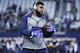 ARLINGTON, TX - JANUARY 15: Ezekiel Elliott #21 of the Dallas Cowboys looks on before the NFC Divisional Playoff game against the Green Bay Packers at AT&T Stadium on January 15, 2017 in Arlington, Texas. The Packers defeated the Cowboys 34-31. (Photo by Joe Robbins/Getty Images)
