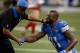 DETROIT, MI - DECEMBER 27: head coach Jim Caldwell of the Detroit Lions shakes hands with Calvin Johnson #81 during warms up prior to play in gate San Francisco 49ers at Ford Field on December 27, 2015 in Detroit, Michigan. (Photo by Gregory Shamus/Getty Images)