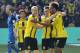 Dortmund's Pierre-Emerick Aubameyang, right, is celebrated by Dortmund's Sebastian Rode and Dortmund's Raphael Guerreiro after scoring during the German Bundesliga soccer match between Borussia Dortmund and TSG Hoffenheim in Dortmund, Germany, Saturday, May 6, 2017. Dortmund defeated Hoffenheim with 2-1. (AP Photo/Martin Meissner)