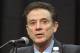 FILE - In a Friday, Feb. 5, 2016 file photo, Louisville head basketball coach Rick Pitino listens to a question during a press conference, in Louisville Ky. The NCAA accuses Louisville of providing impermissible benefits and breaches of conduct as a result of its investigation into an escort's book allegations that former men's basketball staffer Andre McGee hired her and other dancers for sex parties with Cardinals recruits and players. The NCAA sent its' Notice of Official Allegations to the school and released it on Thursday, Oct. 20, 2016. The governing body considers the breaches of conduct Level 1 infractions. The letter does not mention a lack of institutional control, considered the most serious violation, but says that Cardinals coach Rick Pitino failed to monitor McGee. (AP Photo/Timothy D. Easley)