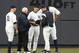 New York Yankees left fielder Brett Gardner (11), Yankees trainer Steve Donohue, Yankees manager Joe Girardi and right fielder Aaron Judge gather around Yankees center fielder Jacoby Ellsbury, third from left, after Ellsbury collided with the outfield wall fielding a flyout by Kansas City Royals' Alcidies Escobar during the first inning of a baseball game at Yankee Stadium in New York, Wednesday, May 24, 2017. The Yankees placed Ellsbury on the seven day DL after the game. (AP Photo/Kathy Willens)