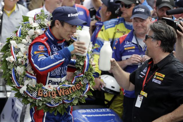 Takuma Sato, left, of Japan, toasts with car owner Michael Andretti as they celebrate after winning the Indianapolis 500 auto race at Indianapolis Motor Speedway, Sunday, May 28, 2017, in Indianapolis. (AP Photo/Darron Cummings)