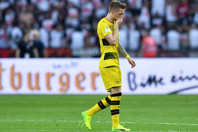 Dortmund's forward Marco Reus walks on the pitch during the German Cup (DFB Pokal) final football match Eintracht Frankfurt v BVB Borussia Dortmund at the Olympic stadium in Berlin on May 27, 2017. / AFP PHOTO / Christof Stache / RESTRICTIONS: ACCORDING TO DFB RULES IMAGE SEQUENCES TO SIMULATE VIDEO IS NOT ALLOWED DURING MATCH TIME. MOBILE (MMS) USE IS NOT ALLOWED DURING AND FOR FURTHER TWO HOURS AFTER THE MATCH. == RESTRICTED TO EDITORIAL USE == FOR MORE INFORMATION CONTACT DFB DIRECTLY AT +49 69 67880

 /         (Photo credit should read CHRISTOF STACHE/AFP/Getty Images)
