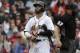 Boston Red Sox's Dustin Pedroia walks to the dugout after he struck out swinging off a pitch by Seattle Mariners' Edwin Diaz in the ninth inning of a baseball game, Sunday, May 28, 2017, in Boston. The Mariners shut out the Red Sox 5-0. (AP Photo/Steven Senne)