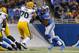 Detroit Lions defensive tackle Ndamukong Suh (90) rushes against Green Bay Packers guard T.J. Lang (70) during the second quarter of an NFL football game at Ford Field in Detroit, Thursday, Nov. 28, 2013. (AP Photo/Paul Sancya)