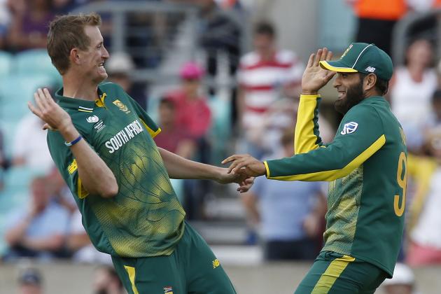 South Africas Imran Tahir (R) celebrates, with South Africas Chris Morris, running out Sri Lankas Suranga Lakmal for a duck during the ICC Champions Trophy match between South Africa and Sri Lanka at The Oval in London on June 3, 2017. / AFP PHOTO / Ian KINGTON / RESTRICTED TO EDITORIAL USE        (Photo credit should read IAN KINGTON/AFP/Getty Images)