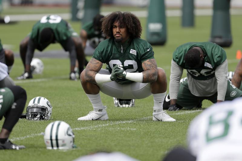 New York Jets defensive lineman Leonard Williams stretches with teammates during the team's organized team activities at its NFL football training facility, Tuesday, May 23, 2017, in Florham Park, N.J. (AP Photo/Julio Cortez)