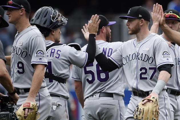 SAN DIEGO, CA - JUNE 4: Trevor Story #27 of the Colorado Rockies, right, high fives Tony Wolters #14 after beating the San Diego Padres 3-1 in a baseball game at PETCO Park on June 4, 2017 in San Diego, California.  (Photo by Denis Poroy/Getty Images)