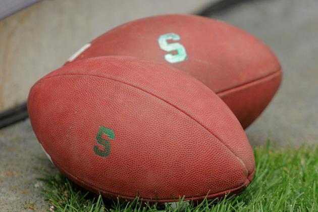 EAST LANSING, MI - SEPTEMBER 04:  A pair of footballs sit on the field before the game between the Michigan State Spartans and the Western Michigan Broncos at Spartan Stadium on September 4, 2010 in East Lansing, Michigan.  (Photo by Mark Cunningham/Getty Images)