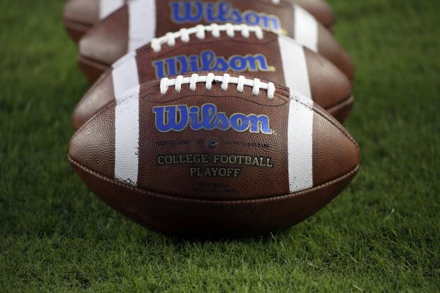 Wilson footballs are lined up on the field before an NCAA college football game between Auburn and Texas A&M Saturday, Nov. 7, 2015, in College Station, Texas. (AP Photo/David J. Phillip)
