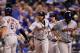 KANSAS CITY, MO - JUNE 05: Yuli Gurriel #10 of the Houston Astros is congratulated by Jake Marisnick #6 after hitting a 3-run home run during the 9th inning of the game against the Kansas City Royals at Kauffman Stadium on June 5, 2017 in Kansas City, Missouri. The Astros defeated the Royals with a final score of 7-3. (Photo by Jamie Squire/Getty Images)