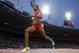 United States' Sanya Richards-Ross crosses the finish line to win gold in the women's 4x400-meter relay final during the athletics in the Olympic Stadium at the 2012 Summer Olympics, London, Saturday, Aug. 11, 2012. (AP Photo/David J. Phillip)