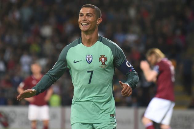 Portugal's forward Cristiano Ronaldo celebrate scoring during the FIFA World Cup 2018 qualification football match between Latvia and Portugal in Riga, on June 9, 2017. / AFP PHOTO / Janek SKARZYNSKI        (Photo credit should read JANEK SKARZYNSKI/AFP/Getty Images)