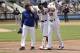 FILE - In this April 27, 2017, file photo, New York Mets' Yoenis Cespedes (52) is helped off the field by first base coach Tom Goodwin (22) and a trainer during the fourth inning of a baseball game against the Atlanta Braves in New York. New York has a number of key players on the disabled list, including outfielder Cespedes. (AP Photo/Frank Franklin II, File)