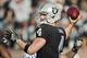 OAKLAND, CA - DECEMBER 24: Quarterback Derek Carr #4 of the Oakland Raiders throws the ball against the Indianapolis Colts in the third quarter on December 24, 2016 at Oakland-Alameda County Coliseum in Oakland, California. The Raiders won 33-25. (Photo by Brian Bahr/Getty Images)