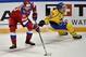 Russia's Ilya Kovalchuk (L) fights for the puck with Sweden's John Norman during the Channel One Cup of the Euro Hockey Tour ice hockey match between Russia and Sweden in Moscow on December 15, 2016. / AFP / Alexander NEMENOV (Photo credit should read ALEXANDER NEMENOV/AFP/Getty Images)
