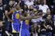 Golden State Warriors forward Draymond Green (23) gestures to fans during the second half against the Cleveland Cavaliers in Game 4 of basketball's NBA Finals in Cleveland, Friday, June 9, 2017. (AP Photo/Ron Schwane)