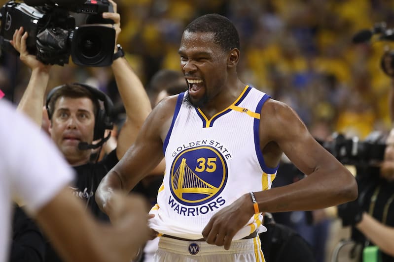 OAKLAND, CA - JUNE 12: Kevin Durant #35 of the Golden State Warriors celebrates after defeating the Cleveland Cavaliers 129-120 in Game 5 to win the 2017 NBA Finals at ORACLE Arena on June 12, 2017 in Oakland, California. NOTE TO USER: User expressly acknowledges and agrees that, by downloading and or using this photograph, User is consenting to the terms and conditions of the Getty Images License Agreement. (Photo by Ezra Shaw/Getty Images)