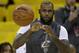 Cleveland Cavaliers forward LeBron James warms up before Game 5 of basketball's NBA Finals between the Golden State Warriors and the Cavaliers in Oakland, Calif., Monday, June 12, 2017. (AP Photo/Ben Margot)