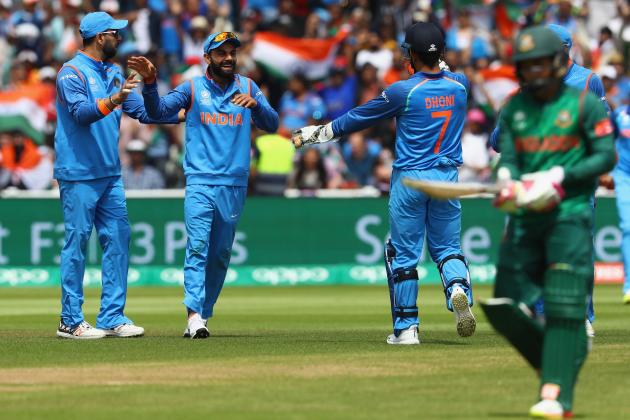 BIRMINGHAM, ENGLAND - JUNE 15:  Virat Kohli (2L) of India celebrates taking a catch off the bowling of Kedar Jadhav to claim the wicket of Mushfiqur Rahim of Bangladesh during the ICC Champions Trophy Semi-Final match between Bangladesh and India at Edgbaston on June 15, 2017 in Birmingham, England.  (Photo by Michael Steele/Getty Images)