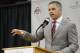 FILE - In this Monday, June 12, 2017, file photo, Chris Holtmann answers questions during a NCAA college basketball news conference introducing him the new men's head basketball coach at Ohio State in Columbus, Ohio. Holtmann's $3 million annual contract includes incentives for making the NCAA Tournament and ensuring his players get good grades. The contract still has to be approved by university trustees, but Ohio State released the terms Wednesday, June 14, 2017. (AP Photo/Jay LaPrete, File)