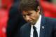 Chelsea's Italian head coach Antonio Conte reacts on the pitch after their defeat to Arsenal after the English FA Cup final football match between Arsenal and Chelsea at Wembley stadium in London on May 27, 2017.
Aaron Ramsey scored a 79th-minute header to earn Arsenal a stunning 2-1 win over Double-chasing Chelsea on Saturday and deliver embattled manager Arsene Wenger a record seventh FA Cup. / AFP PHOTO / Adrian DENNIS / NOT FOR MARKETING OR ADVERTISING USE / RESTRICTED TO EDITORIAL USE (Photo credit should read ADRIAN DENNIS/AFP/Getty Images)