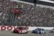 Jimmie Johnson (48) takes the checkered flag under caution to win a NASCAR Cup series auto race, Sunday, June 4, 2017, at Dover International Speedway in Dover, Del. Kyle Larson (42) came in second. (AP Photo/Nick Wass)