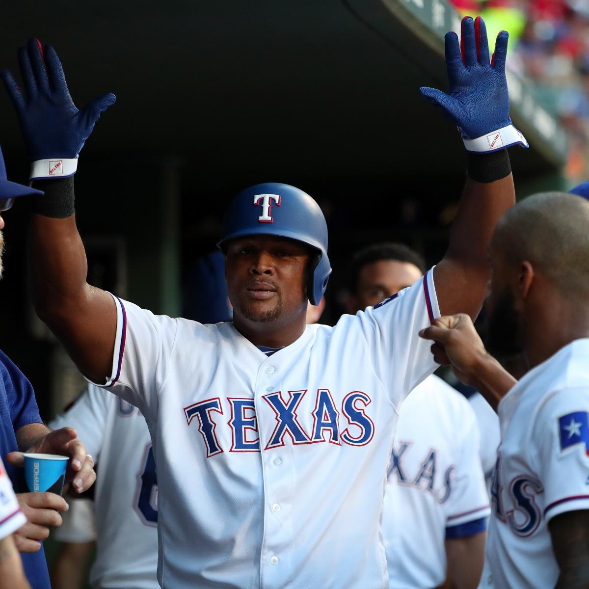 Retired player Adrian Beltre, jokingly tosses a robe gifted to him