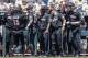 Louisville's Colin Lyman (35) is greeted at the dugout after scoring against Texas A&M on a two-run single by Colby Fitch in the third inning of an NCAA College World Series baseball game in Omaha, Neb., Sunday, June 18, 2017. Louisville won 8-4. (AP Photo/Nati Harnik)