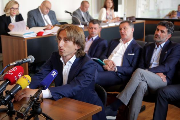 Croatia and Real Madrid midfielder Luka Modric appears in court to testify in a corruption trial in Osijek on June 13, 2017.
Modric swapped his football kit for a suit as he appeared in the witness box to testify in a multi-million-euro corruption trial against Dinamo Zagreb's ex chairman. The 31-year-old star midfielder is to give evidence at the trial of controversial Zdravko Mamic, considered the most powerful man in Croatian football. / AFP PHOTO / STR (Photo credit should read STR/AFP/Getty Images)