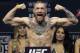 Conor McGregor stands on a scale during the weigh-in event for his fight against Eddie Alvarez in UFC 205 mixed martial arts, Friday, Nov. 11, 2016, at Madison Square Garden in New York. (AP Photo/Julio Cortez)