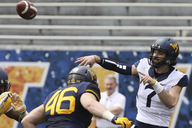 West Virginia quarterback Will Grier (7) throws a pass during the first half of an NCAA college football spring game, Saturday, April 15, 2017, in Morgantown, W.Va. The blue team defeated the gold team 44-21. (AP Photo/Raymond Thompson)