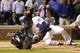 San Diego Padres catcher Austin Hedges rolls on the ground still holding the ball after Hedges tagged out Chicago Cubs' Anthony Rizzo during a collision at home during the sixth inning of a baseball game Monday, June 19, 2017, in Chicago. (AP Photo/Charles Rex Arbogast)