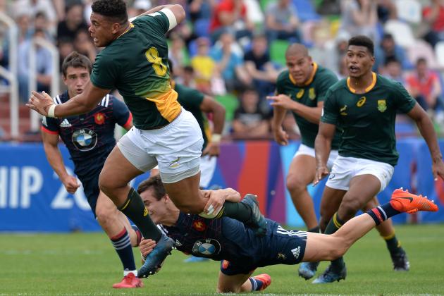 TBILISI, GEORGIA - JUNE 18: Juarno Augustus of South Africa is tackled by Arthur Coville of France during the World Rugby U20 Championship 3rd Place Playoff match between France and South Africa at Mikheil Meskhi Stadium on June 18, 2017 in Tbilisi, Georgia. (Photo by Mark Runnacles/Getty Images)