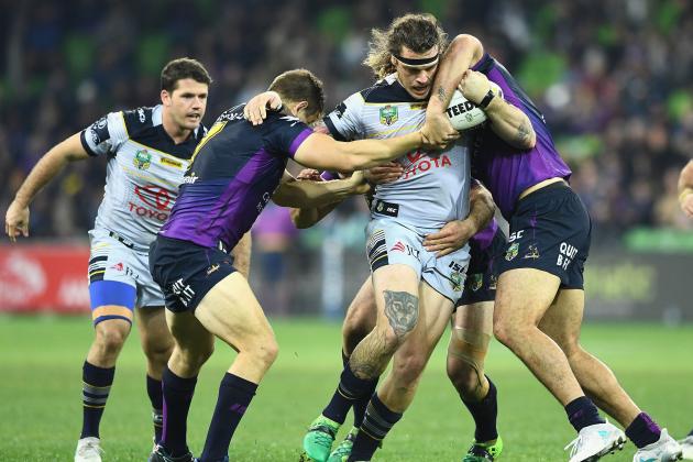 MELBOURNE, AUSTRALIA - JUNE 17:  Ethan Lowe of the Cowboys is tackled during the round 15 NRL match between the Melbourne Storm and the North Queensland Cowboys at AAMI Park on June 17, 2017 in Melbourne, Australia.  (Photo by Quinn Rooney/Getty Images)