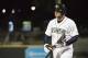 FILE - In this April 6, 2017, file photo, Columbia Fireflies' Tim Tebow returns to the dugout after striking out during the team's minor league baseball game against the Augusta GreenJackets, in Columbia, S.C. The first half of Tebow’s first professional baseball season is complete. It did not end on a high note. (AP Photo/Sean Rayford, File)