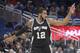 San Antonio Spurs forward LaMarcus Aldridge (12) celebrates after scoring during the first half of the team's NBA basketball game against the Orlando Magic in Orlando, Fla., Wednesday, Feb. 15, 2017. (AP Photo/Phelan M. Ebenhack)