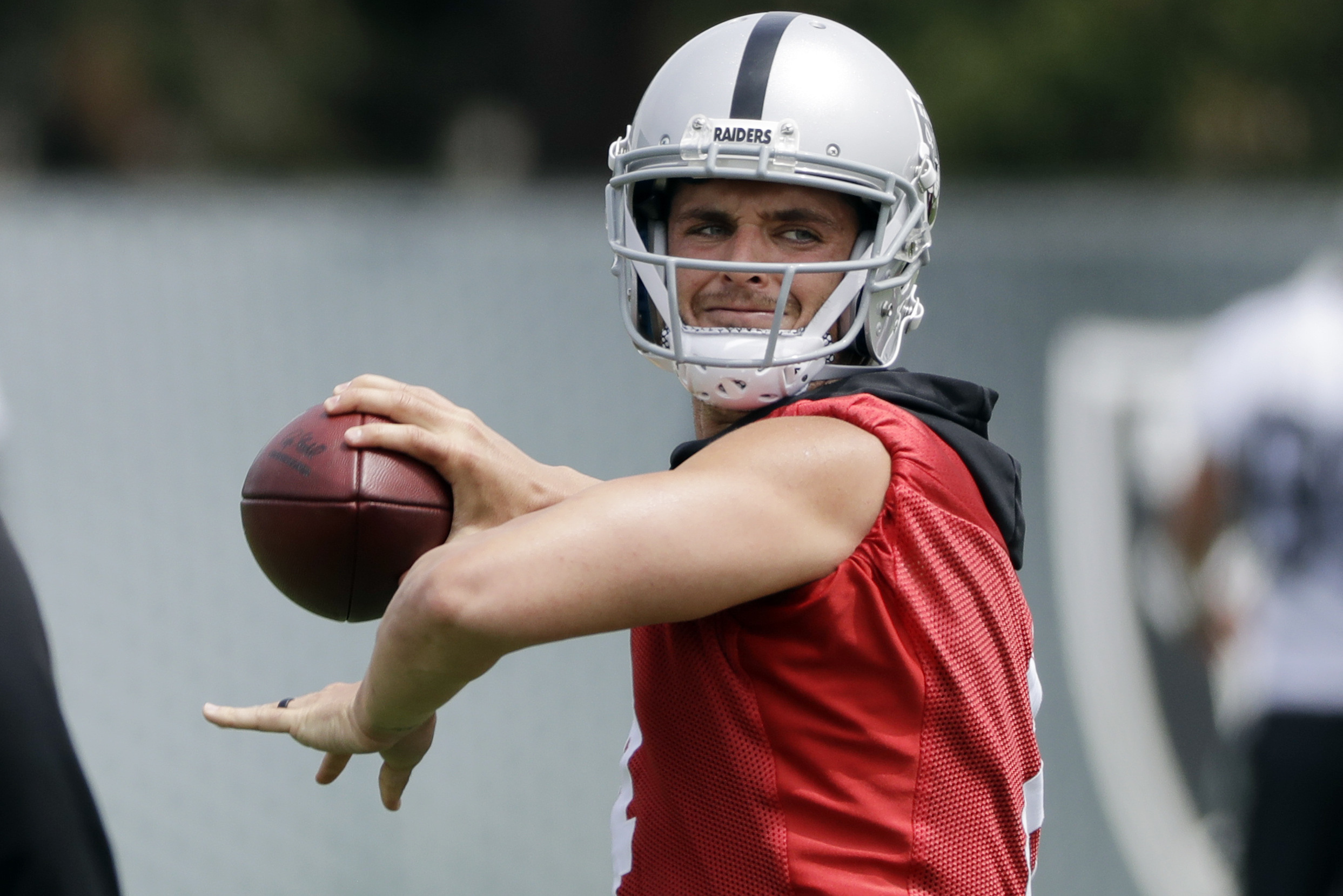 Raiders QB Derek Carr gives a pump fake to rumor-mongers