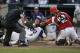 TCU's Josh Watson (7) is safe at home before the tag by Louisville catcher Colby Fitch during the second inning of an NCAA College World Series baseball game in Omaha, Neb., Thursday, June 22, 2017. (AP Photo/Nati Harnik)