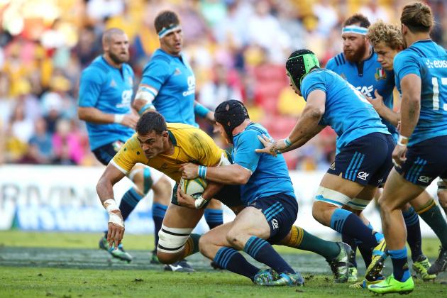 BRISBANE, AUSTRALIA - JUNE 24: Rory Arnold of the Wallabies is tackled during the International Test match between the Australian Wallabies and Italy at Suncorp Stadium on June 24, 2017 in Brisbane, Australia.  (Photo by Cameron Spencer/Getty Images)