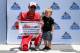 SONOMA, CA - JUNE 24: Kyle Larson, driver of the #42 Target Chevrolet, and his son, Owen, pose with the Coors Light Pole Award after qualifying for the Monster Energy NASCAR Cup Series Toyota/Save Mart 350 at Sonoma Raceway on June 24, 2017 in Sonoma, California. (Photo by Sarah Crabill/Getty Images)