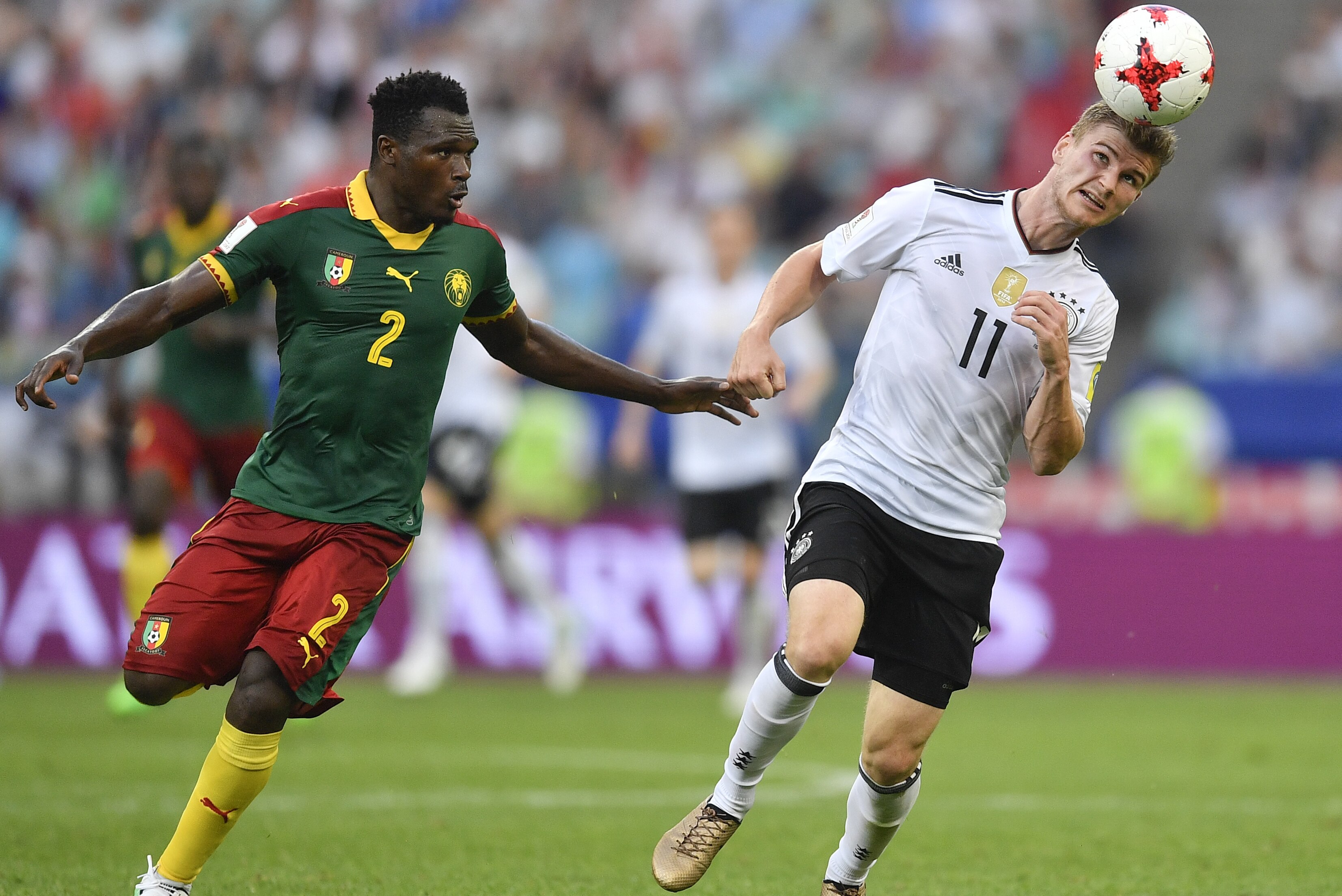 Germany's Timo Werner heads the ball past Cameroon's Ernest Mabouka during the Confederations Cup, Group B soccer match between Germany and Cameroon, at the Fisht Stadium in Sochi, Russia, Sunday, June 25, 2017. (AP Photo/Martin Meissner)