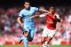 LONDON, ENGLAND - SEPTEMBER 13: Sergio Aguero of Manchester City and Alexis Sanchez of Arsenal battle for the ball during the Barclays Premier League match between Arsenal and Manchester City at Emirates Stadium on September 13, 2014 in London, England. (Photo by Shaun Botterill/Getty Images)