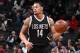 BROOKLYN, NY - MARCH 21: K.J. McDaniels #14 of the Brooklyn Nets handles the ball against the Detroit Pistons on March 21, 2017 at Barclays Center in Brooklyn, New York. NOTE TO USER: User expressly acknowledges and agrees that, by downloading and or using this Photograph, user is consenting to the terms and conditions of the Getty Images License Agreement. Mandatory Copyright Notice: Copyright 2017 NBAE (Photo by Nathaniel S. Butler/NBAE via Getty Images)