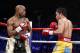 Floyd Mayweather Jr. exchange punches with Manny Pacquiao during their welterweight unification championship bout, May 2, 2015 at MGM Grand Garden Arena in Las Vegas, Nevada. Mayweather defeated Pacquiao by unanimous decision. AFP PHOTO / JOHN GURZINKSI (Photo credit should read JOHN GURZINSKI/AFP/Getty Images)