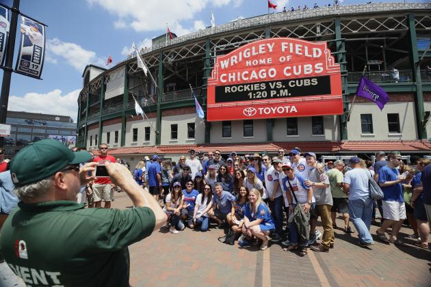 CHICAGO, IL - JUNE 09:  Fans have their picture taken in front of the marquee at Wrigley Field before a game between the Chicago Cubs and the Colorado Rockies on June 9, 2017 in Chicago, Illinois.  (Photo by Jonathan Daniel/Getty Images)