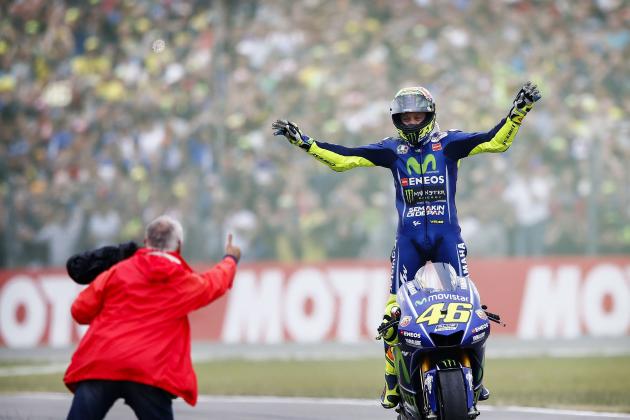 TOPSHOT - Italy's Valentino Rossi celebrates after winning the Assen Motorcycling Grand Prix at the TT circuit in Assen on June 25, 2017.  / AFP PHOTO / ANP / Vincent Jannink / Netherlands OUT        (Photo credit should read VINCENT JANNINK/AFP/Getty Images)