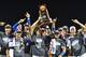 OMAHA, NE - JUNE 27: Players of the Florida Gators hold up the National Championship Trophy after defeating the LSU Tigers 6-1 at the College World Series on June 27, 2017 at TD Ameritrade Park in Omaha, Nebraska. (Photo by Peter Aiken/Getty Images)