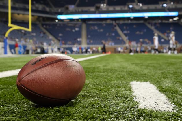 NFL football on the turf before a preseason NFL football game  between the Detroit Lions and the Jacksonville Jaguarsat Ford Field in Detroit, Friday, Aug. 22, 2014. (AP Photo/Rick Osentoski)